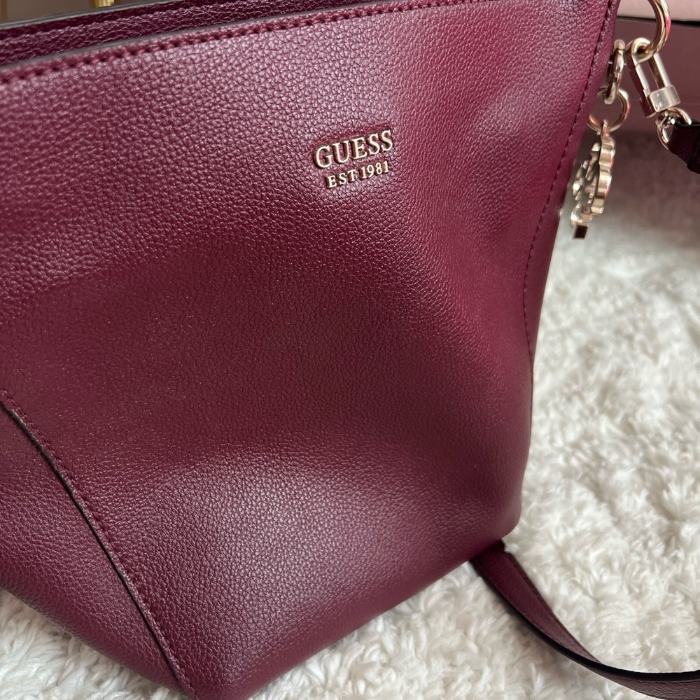 Guess Crossbody Handbag, great condition, wine color with gold accent metal.